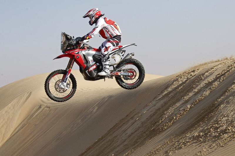 Paulo Goncalves jumps a dune during Day 2 of the Abu Dhabi Desert Challenge on April 7 2014. Goncalves is third in the motorcycle class behind KTM teammates Marc Coma and Sam Sunderland. Courtesy Abu Dhabi Desert Challenge