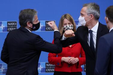 US Secretary of State Antony Blinken and Nato Secretary General Jens Stoltenberg bump elbows at the end of a debate at a Nato foreign ministers' meeting at the alliance's headquarters in Brussels. Reuters