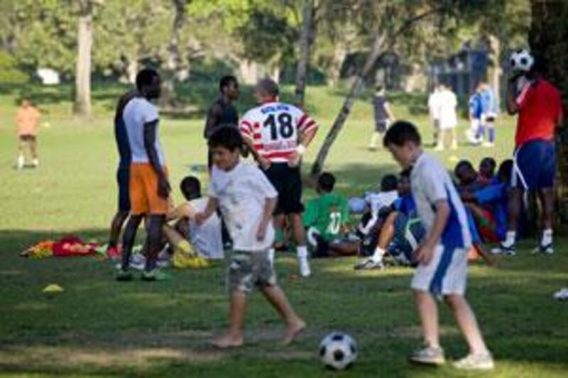 People play football at Safa Park in Jumeirah.