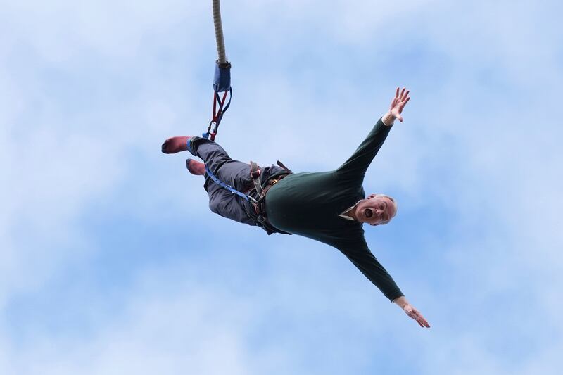Liberal Democrat leader Ed Davey bungee jumps during a visit to Eastbourne Borough Football Club in East Sussex. AP