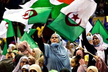 Supporters of Algeria's Movement of Society for Peace (MSP) political party attend a campaign rally in the capital Algiers on June 8, 2021. / AFP / RYAD KRAMDI
