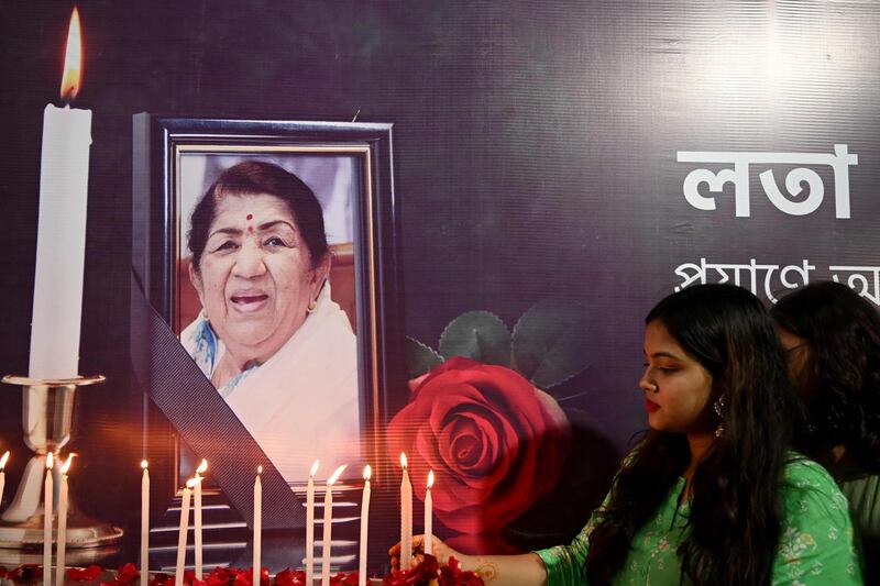 People pay tribute to Indian singer Lata Mangeshkar in Kolkata on Sunday, after she died at the age of 92. AFP