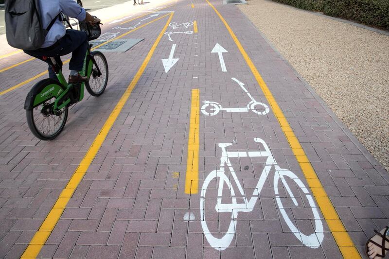 DUBAI, UNITED ARAB EMIRATES. 26 OCTOBER 2020. E-scooter trials rolled out in five areas across city for a year long project for commuters to rent and use e-scooters while commuting to and from tram and metro stations. Special cycle and scooter lanes in JLT next to Al Mas tower. (Photo: Antonie Robertson/The National) Journalist: Kelly Clarke. Section: National.
