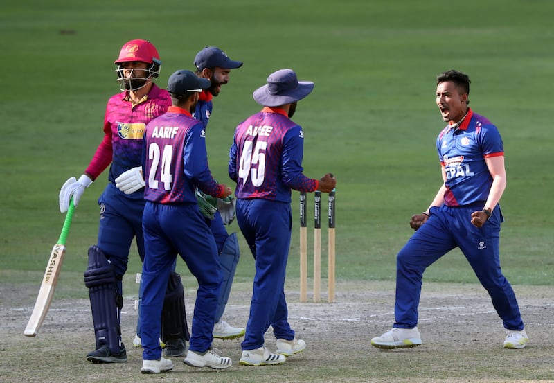 Nepal's Sompal Kami, who finished with 3 for 26, dismisses the UAE's Rohan Mustafa for six.