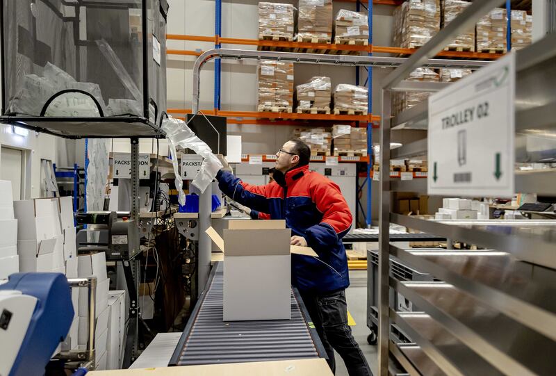 A worker prepares vaccines for shipment at the Movianto distribution centre in Oss, in the Netherlands. EPA