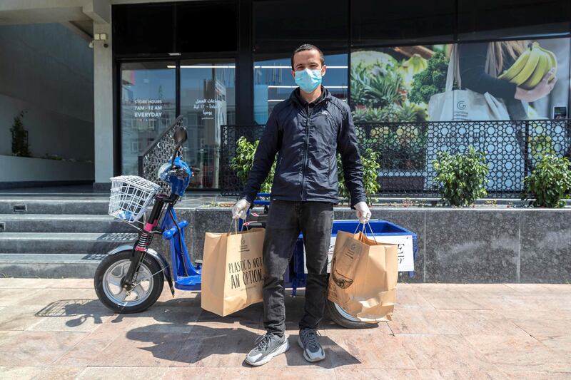 DUBAI, UNITED ARAB EMIRATES. 25 MARCH 2020. Unsung Heroes of the UAE project.  Supermarket Home Delivery guy. Krishna Kharal (Nepal) an employee at Grandiose Supermarket on Beach rd in Jumeirah, that is resposnible for home delivery orders while wearing a protective mask and gloves to avoid the possible spread of disease while keeping food and necessities available to customers. (Photo: Antonie Robertson/The National) Journalist: None. Section: National.