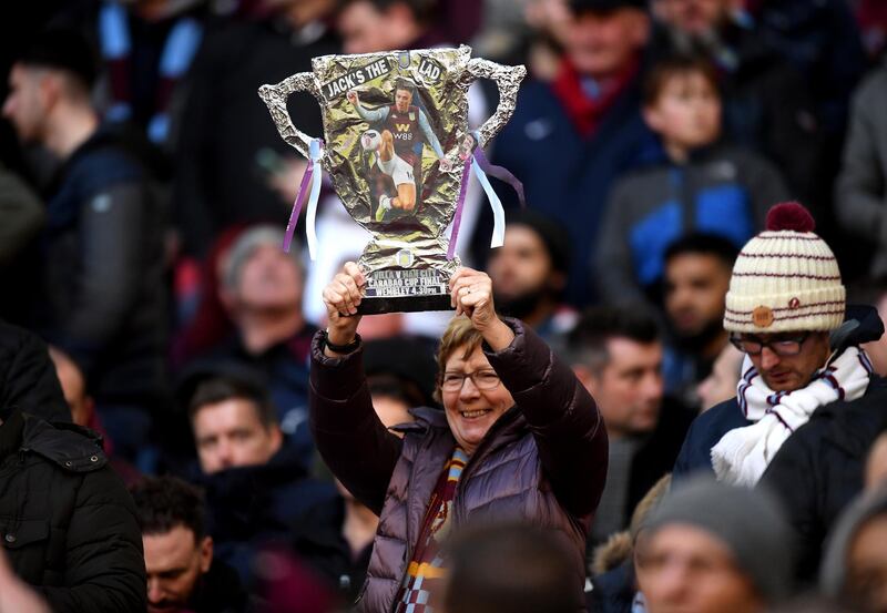 An Aston Villa fan holds a tin foil trophy up prior to the League Cup Final between Aston Villa and Manchester City. Getty Images