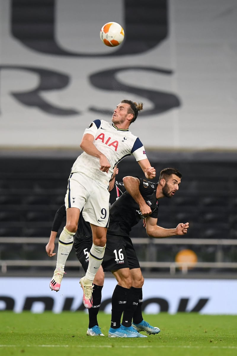 Tottenham attacker Gareth Bale outjumps LASK's Marvin Potzmann. AFP