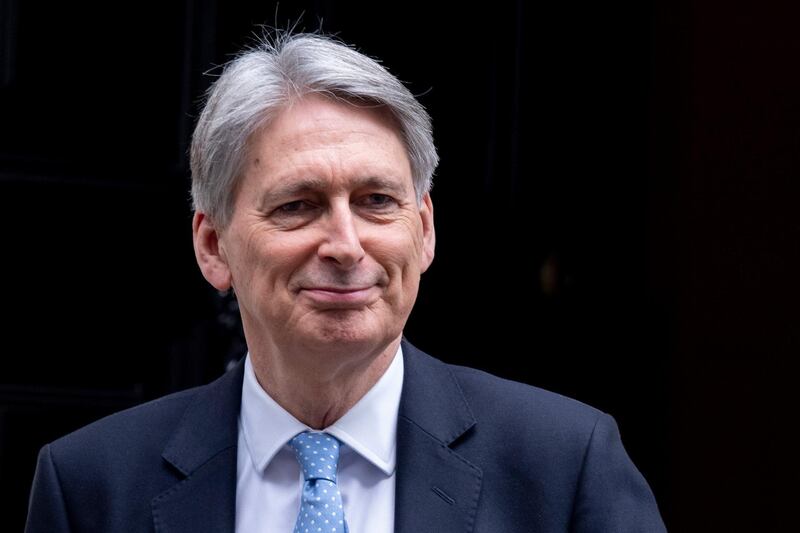 epa07225544 British Chancellor of the Exchequer Philip Hammond leaves 11 Downing Street in London, Britain, 12 December 2018, to attend Prime Ministers Questions in the Houses of Parliament. Prime Minister Theresa May will face a challenge to her leadership on 12 December 2018 after 48 letters calling for a contest were delivered to the Chariman of the 1922 Committee. May will find out her future after Conservative Members of Parliament vote between 18:00 GMT and 20:00 GMT later in the evening.  EPA/WILL OLIVER