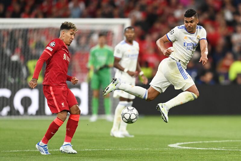 Roberto Firmino of Liverpool is challenged by Casemiro of Real Madrid during the Uefa Champions League final. Getty 
