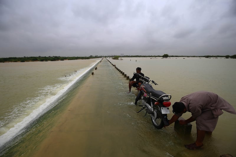 Flooding after heavy rains in Karachi, Pakistan. Flash floods killed 830 people, including 313 children, across the country in the past two months, the National Disaster Management Authority has said. EPA