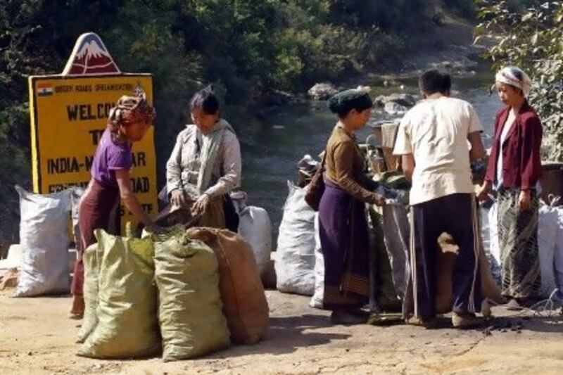 While both countries are keen for legal border trade, such as these Myanmar charcoal labourers, India appears ill placed on the ground to exploit Myanmar's opening.