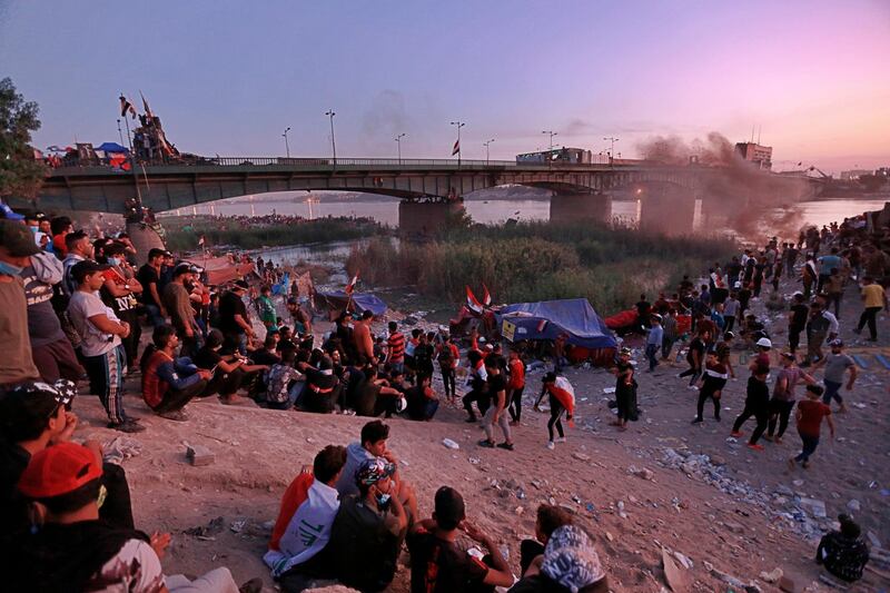 Anti-government protesters stage a sit-in around a bridge leading to the Green Zone government areas in Baghdad. AP Photo