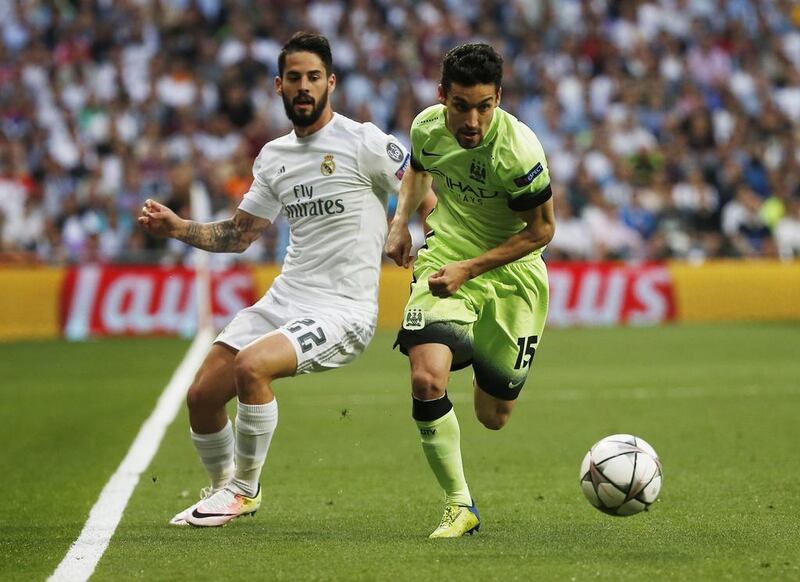 Real Madrid’s Isco in action with Manchester City’s Jesus Navas. Sergio Perez / Reuters
