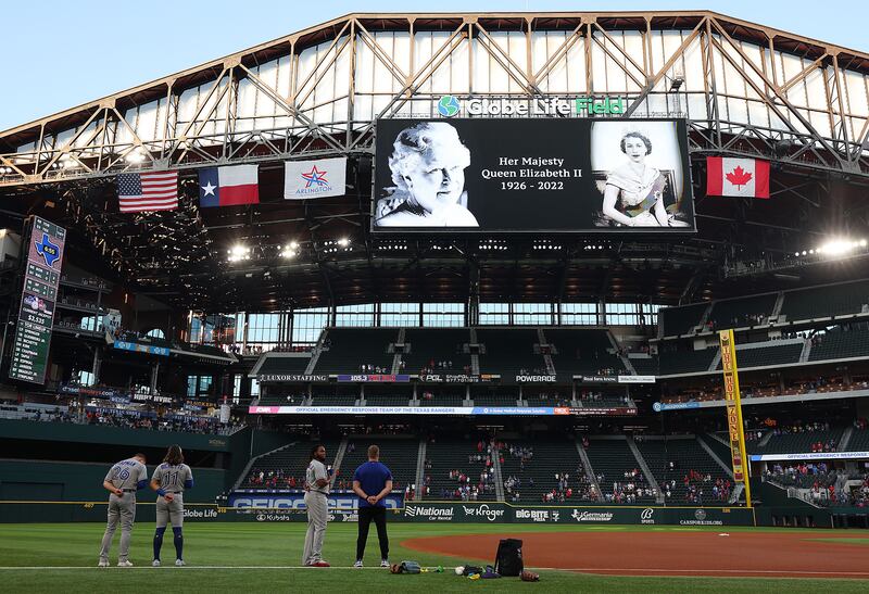 The Texas Rangers observe a moment of silence to honour the passing of Queen Elizabeth before a game against the Toronto Blue Jays at Globe Life Field in Arlington, Texas. Getty Images / AFP