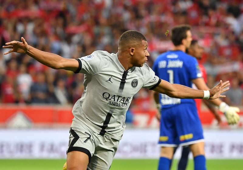 Paris Saint-Germain's French forward Kylian Mbappe celebrates scoring his team's first goal against Lille OSC after only eight seconds at Stade Pierre-Mauroy in Villeneuve-d'Asq, northern France on August 21, 2022.  AFP