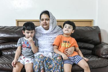 Mahjbeen Ahmed, Mr Ali's wife, with their two sons, Ariz, 3, and Abban, 4. Khushnum Bhandari for The National