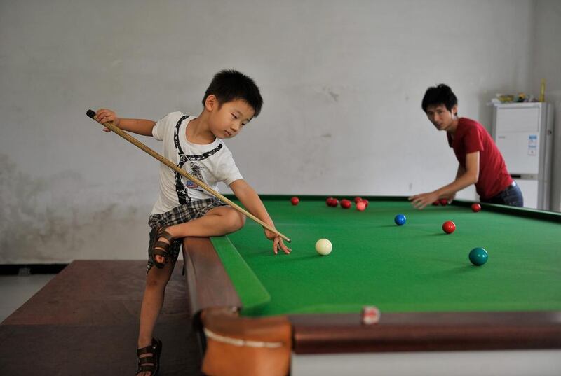 Wuka trains under the careful watch of Wang Yin, his father, a snooker fan who got his son a table when he realised he had the talent. Reuters