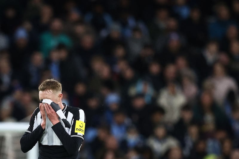 Newcastle United's Sean Longstaff looks disappointed. AFP
