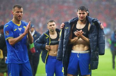  Andriy Yarmolenko and Roman Yaremchuk of Ukraine look dejected as they applaud fans following their defeat. Getty