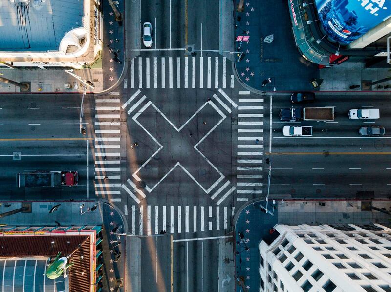 An aerial view at the pedestrian intersection at Hollywood Blvd and Highland Ave during morning rush hour in Los Angeles, California during the coronavirus COVID-19 pandemic.  AFP