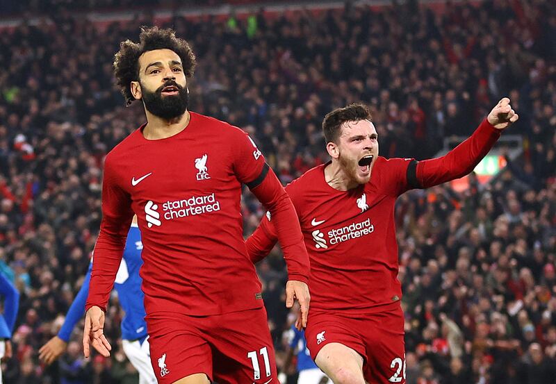 Mohamed Salah celebrates with with Andrew Robertson after scoring Liverpool's first goal. Reuters