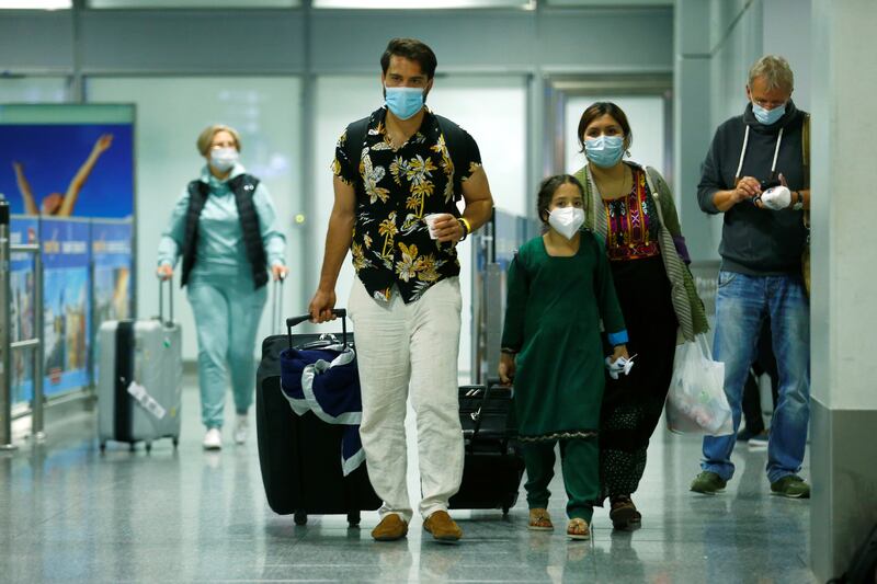 A family arrives at Frankfurt Airport, Germany.