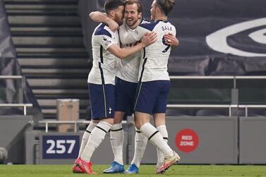 Tottenham's Harry Kane celebrates with teammates Gareth Bale (R) and Matt Doherty after scoring the third against Crystal Palace. EPA