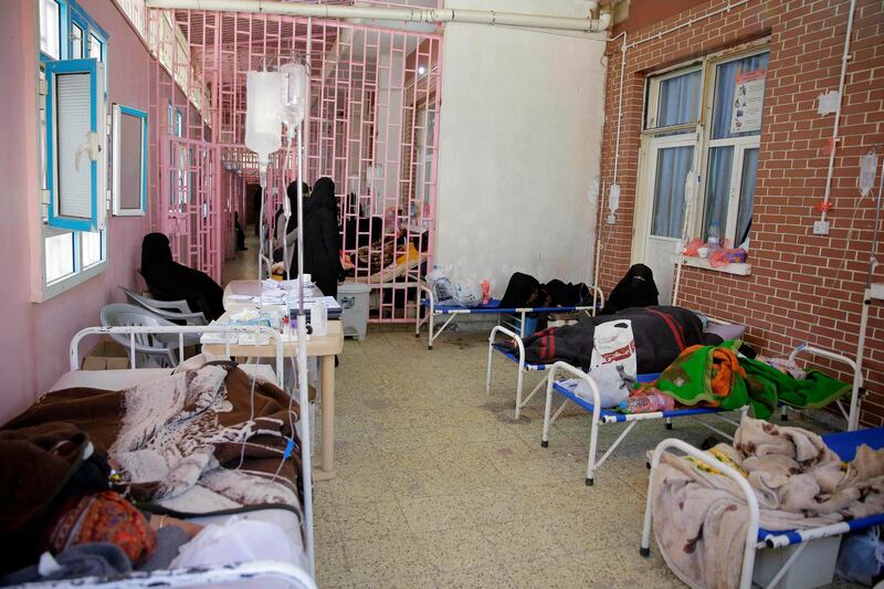 FILE - In this March 30, 2019 file photo, women are treated for suspected cholera infection at Al-Sabeen hospital, in Sanaa, Yemen. An Associated Press investigation found some of the United Nations aid workers sent in to Yemen amid a humanitarian crisis caused by five years of civil war have been accused of enriching themselves from an outpouring of donated food, medicine and money. Documents from an internal probe of the U.N.â€™s World Health Organization uncovered allegations of large funds deposited in staffersâ€™ personal bank accounts, suspicious contracts, and tons of donated medicine diverted or unaccounted for. (AP Photo/Hani Mohammed, File)