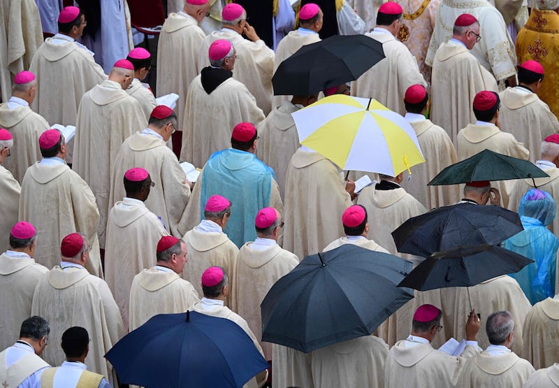 The heavens open as cardinals and bishops attend a beatification mass for John Paul I in the Vatican. AFP