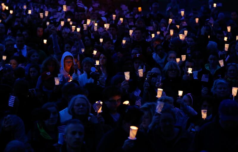BOSTON, MA - APRIL 16: People gather with candles during a vigil for eight-year-old Martin Richard, from Dorchester, who was killed by an explosion near the finish line of the Boston Marathon on April 16, 2013 at Garvey Park in Boston, Massachusetts. The twin bombings resulted in the deaths of three people and hospitalized at least 128. The bombings at the 116-year-old Boston race resulted in heightened security across the nation with cancellations of many professional sporting events as authorities search for a motive to the violence.   Jared Wickerham/Getty Images/AFP== FOR NEWSPAPERS, INTERNET, TELCOS & TELEVISION USE ONLY ==
 *** Local Caption ***  926096-01-09.jpg