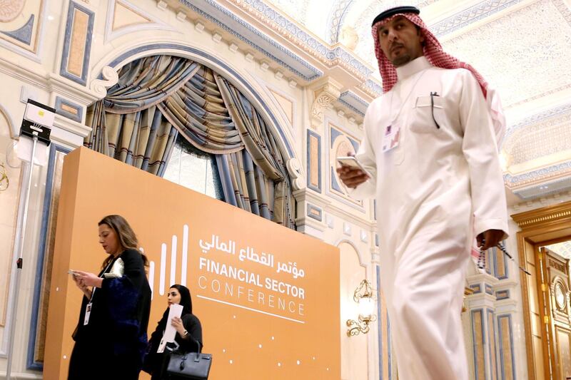Attendees walk during financial sector conference in Riyadh, Saudi Arabia. Reuters