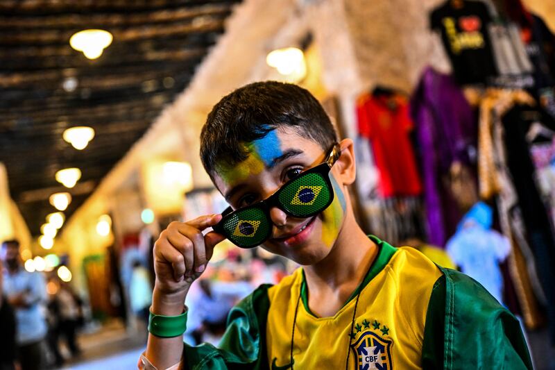 A young Brazil fan at the Souq Waqif marketplace in Doha. AFP