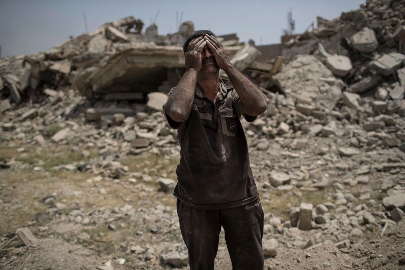 
                  <p>Ammar Mohammed cries while standing next to the body of his daughter, not seen, who died during fighting between Iraqi forces and Islamic State militants in Mosul, Iraq, Saturday, July 8, 2017. (AP Photo/Felipe Dana)</p>
               