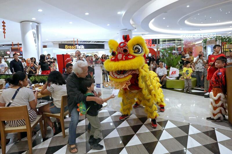 A lion dance is performed in the celebration for the upcoming Chinese New Year at a shopping mall on the outskirts of Jakarta, Indonesia. Tatan Syuflana / AP photo