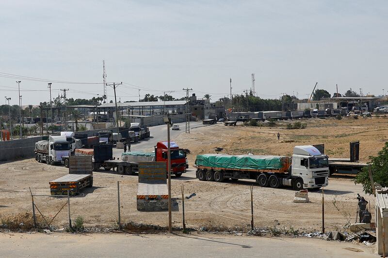 Lorries carrying aid wait to exit on the Gaza side of the Rafah border crossing with Egypt. Reuters