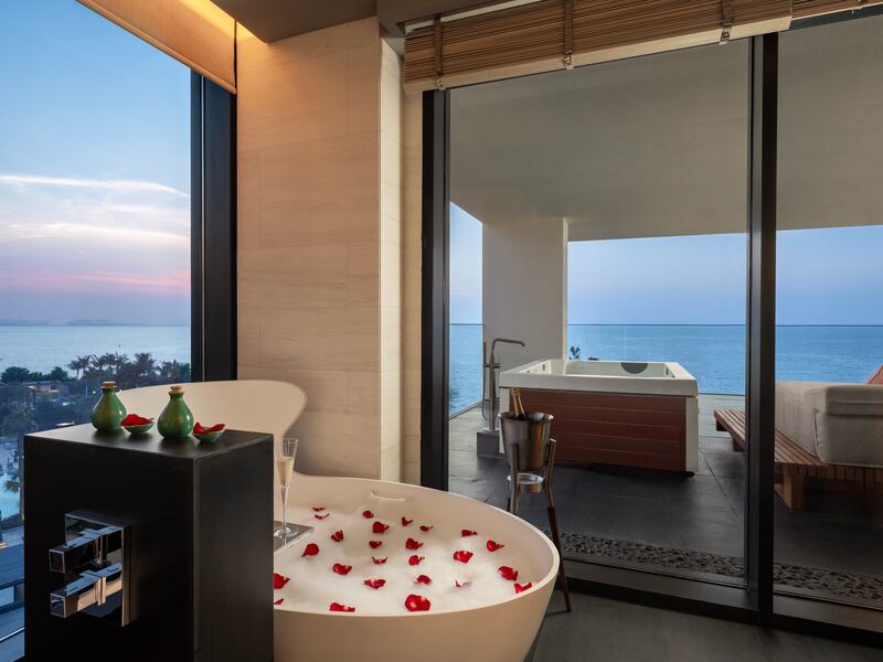 Guests can enjoy a soak overlooking the Arabian Gulf