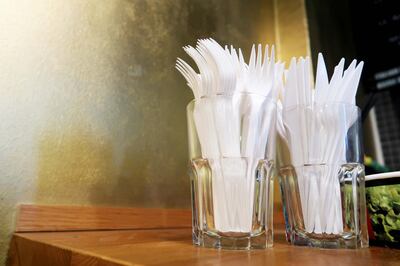 Plastic Forks In Glasses On Table. Getty Images