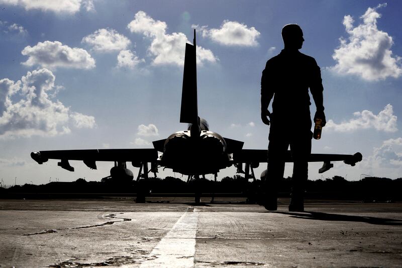 This photo taken on September 22, 2016 shows a British soldier walking by a Eurofighter Typhoon fighter jet at Royal Air Force's Akrotiri base in Cyprus, before taking off for a coalition mission over Iraq. 

British Tornado and Typhoon aircraft stationed at a UK air base in Cyprus are pounding Islamic State targets ahead of a major offensive by Iraqi security forces next month to recapture the key northern city of Mosul, a senior Royal Air Force officer said. Air Commodore Sammy Sampson said Iraqi forces are confident they can retake the country���s second-largest city from IS and that British warplanes will provide the needed support.  / AFP PHOTO / POOL / Petros Karadjias