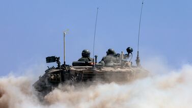 An Israeli tank travels along the border with Gaza. There is no sign yet of a pause in the war. AP