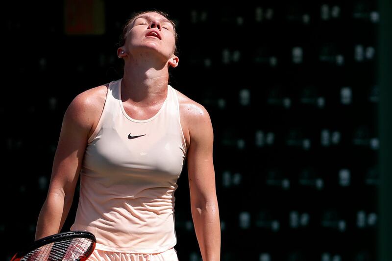 Mar 24, 2018; Key Biscayne, FL, USA; Simona Halep of Romania reacts after losing a point against Agnieszka Radwanska of Poland (not pictured) on day five of the Miami Open at Tennis Center at Crandon Park. Radwanska won 3-6, 6-2, 6-3. Mandatory Credit: Geoff Burke-USA TODAY Sports