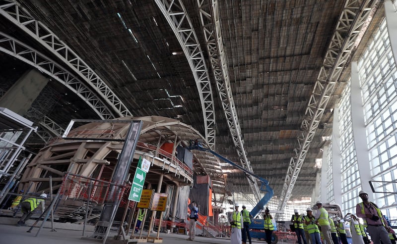 Visitors and journalists tour the construction site of the Midfield Terminal of Abu Dhabi International Airport. Reuters