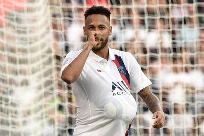 Paris Saint-Germain's Brazilian forward Neymar celebrates after scoring a goal during the French L1 football match between Paris Saint-Germain (PSG) and Racing Club de Strasbourg Alsace (RCS) on September 14, 2019 at the Parc des Princes stadium in Paris. / AFP / Martin BUREAU
