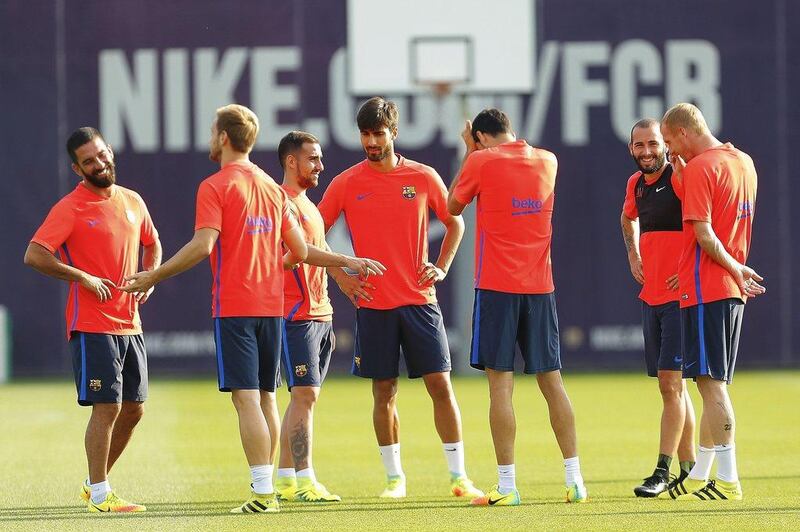 From left to right: Arda Turan, Ivan Rakitic, Paco Alcacer, Andre Gomes, Sergio Busquets, Aleix Vidal and Jeremy Mathieu, during a training session. Alejandro Garcia / EPA
