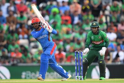 SOUTHAMPTON, ENGLAND - JUNE 24: Gulbadin Naib of Afghanistan bats watched on by Mushfiqur Rahim of Bangladesg during the Group Stage match of the ICC Cricket World Cup 2019 between Bangladesh and South Africa at The Hampshire Bowl on June 24, 2019 in Southampton, England. (Photo by Alex Davidson/Getty Images)