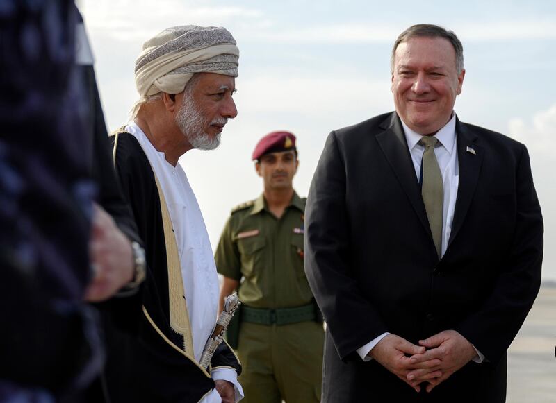 US Secretary of State Mike Pompeo is greeted by Oman's Minister of Foreign Affairs Yusuf bin Alawi bin Abdullah, left, upon his arrival in the Oman capital of Muscat, Friday Feb. 21, 2020. (Andrew Caballero-Reynolds/Pool via AP)