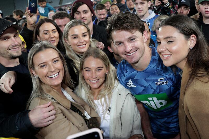 Beauden Barrett of the Blues meets fans after the round 1 Super Rugby match between the Blues and the Hurricanes at Eden Park on Sunday. Getty