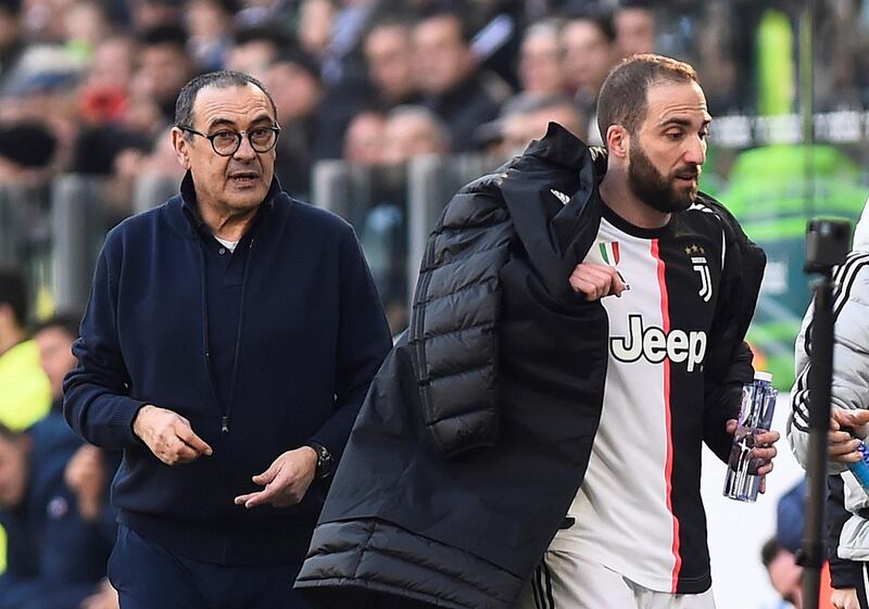 Juventus' Gonzalo Higuain with coach Maurizio Sarri after being substituted. Reuters
