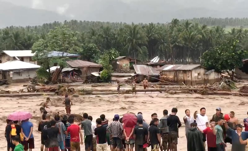 People attempt to rescue flood victims in Lanao Del Norte, Philippines, in this December 22, 2017 photo obtained from social media. in this picture obtained from social media. Courtesy Aclimah Cabugatan Disumala via REUTERS THIS IMAGE HAS BEEN SUPPLIED BY A THIRD PARTY. MANDATORY CREDIT. NO RESALES. NO ARCHIVES
