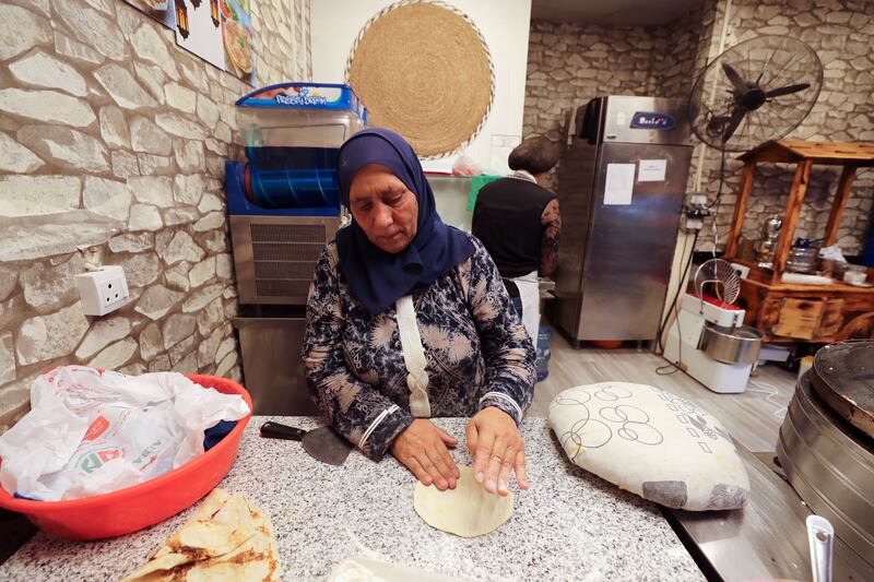 Moutyaa Al Chayah, a cook from Baalbek, Lebanon, bakes manakeesh.